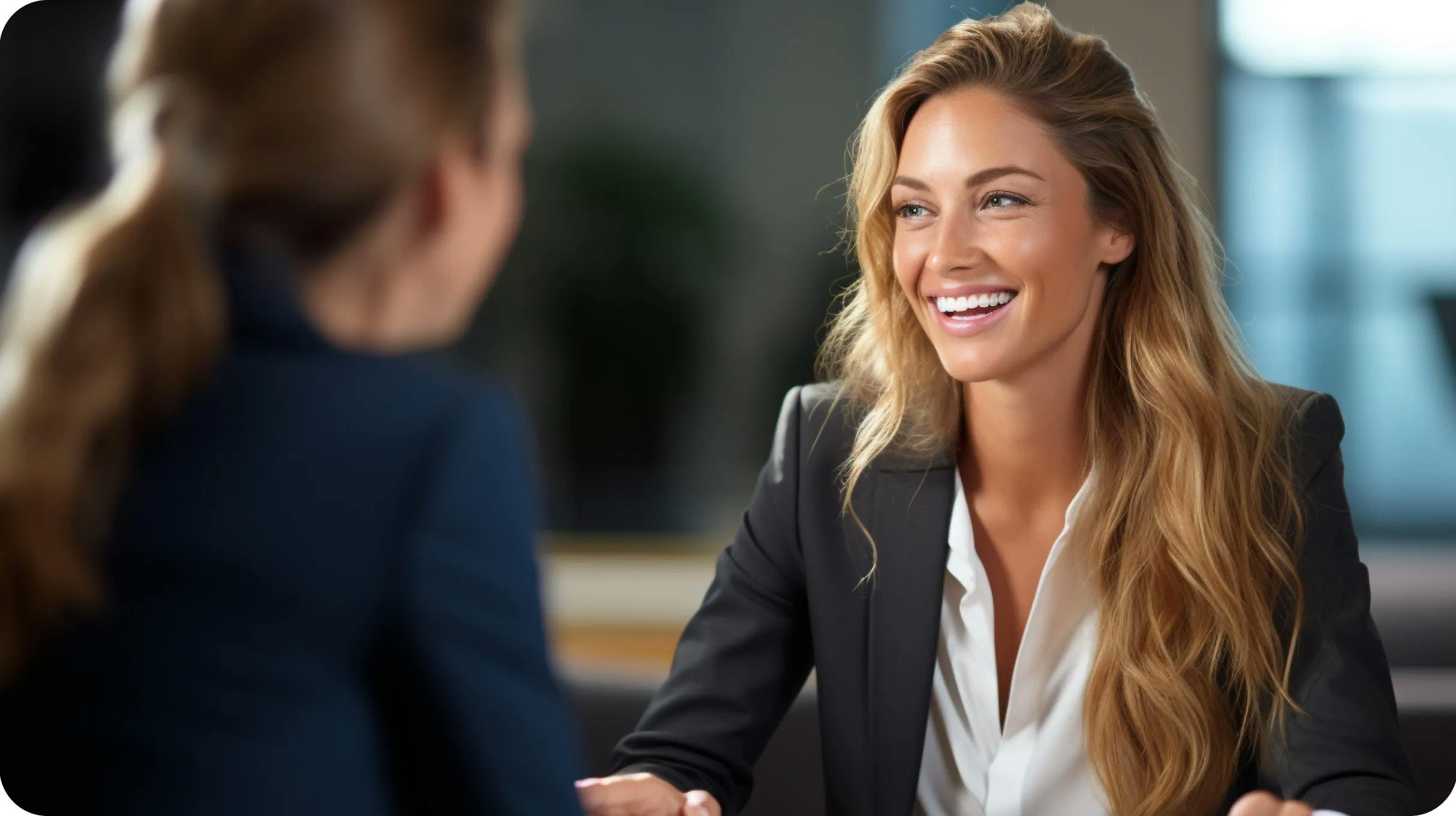 A happy woman talking in a office space